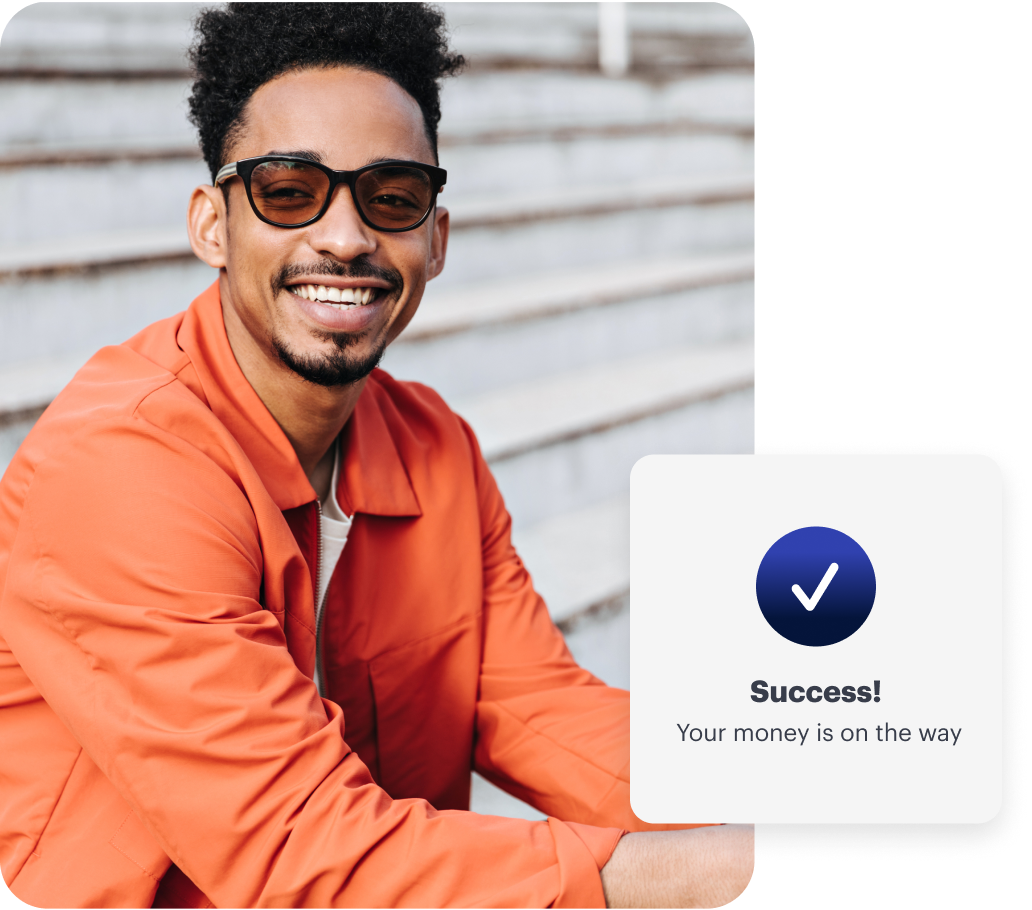 A man in an orange jacket smiles outdoors. A notification overlay reads, “Success! Your money is on the way,” with a checkmark icon.