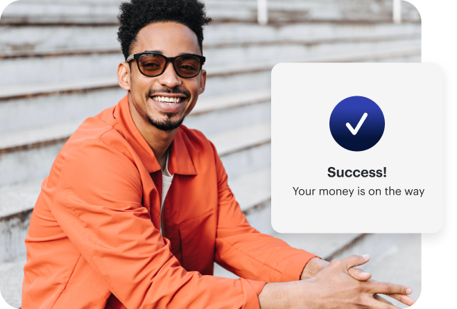 A smiling man in an orange jacket sits on steps. An overlay shows a checkmark and the message: "Success! Your money is on the way.